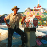 Leonard Knight next to his Salvation Mountain.
