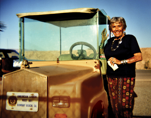 Petre Melvin and her golf cart in Bombay Beach.