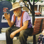 Poppa Neutrino sits on a park bench