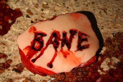 Bane logo cut into flesh
