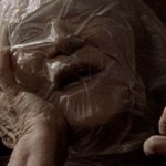 Elderly woman suffocating with a plastic bag over her head