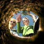 Mother and grandmother wave goodbye at a grave