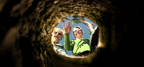 Mother and grandmother wave goodbye at a grave