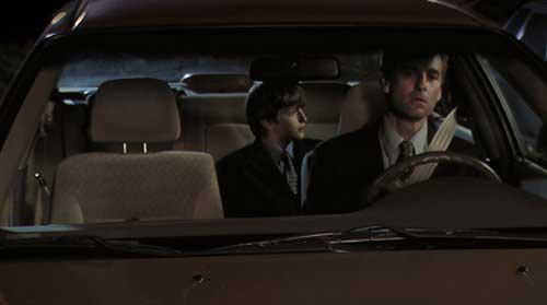 Man and son sitting in a car