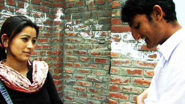 A Kashmir man and woman flirt with each other