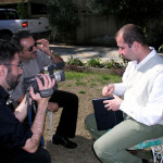 Filmmaker Usama Alshaibi films an interview with an Iraqi man