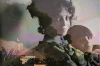 Ghostly image of filmmaker Usama Alshaibi as a child sitting with his mother