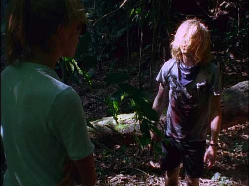 Young woman and stoner guy have a discussion in the jungle
