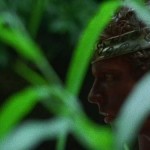 Young man wearing a headband in the jungle