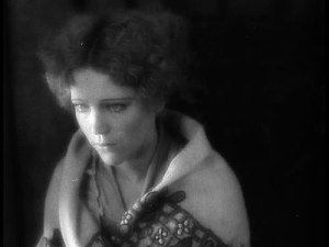 Woman in silent movie looking forlorn