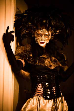 Woman wearing a mask and a bizarre costume