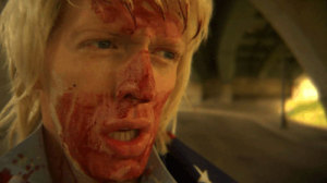 Man with blond hair and a bloody face