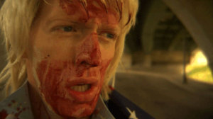Man with blond hair and a bloody face
