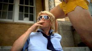Teenage boy smokes a cigarette