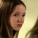 Young girl with blood spatter on her face