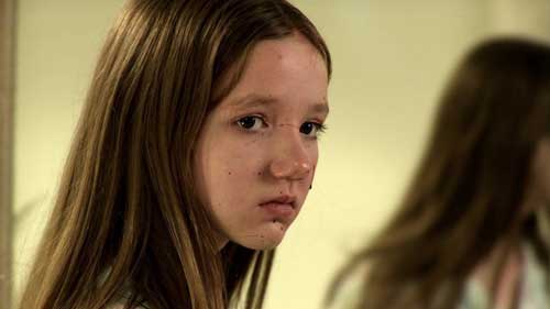 Young girl with blood spatter on her face