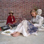 Wren and Lilie Bytheway-Hoy as two hippie teenage girls creating art outside