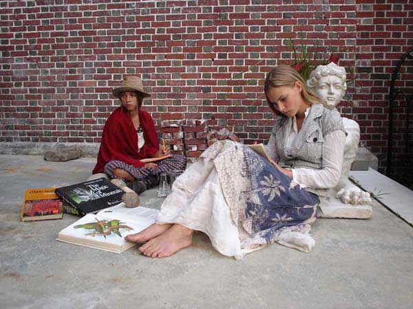 Wren and Lilie Bytheway-Hoy as two hippie teenage girls creating art outside