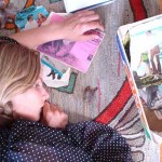 Lilie Bytheway-Hoy has fallen asleep on her artwork