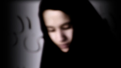 Young Muslim woman wears a black hajib