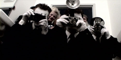 Photographers snap pictures with old-fashioned cameras