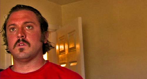 Close up of a bank robber in a hotel room