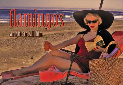 Woman in swimsuit lounges in a chair on a beach