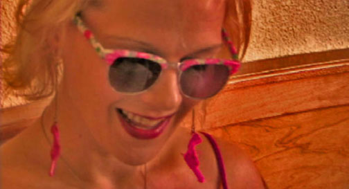 Woman wearing brightly colored sunglasses