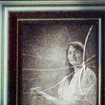 Shattered old time photograph of woman