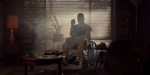 Actor Richard Mellick as Edmond Bloom sitting in a wheelchair