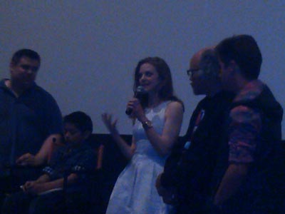 Actress Ashley Bell address the audience after a movie screening