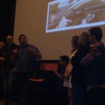 Christopher Folino (with microphone)