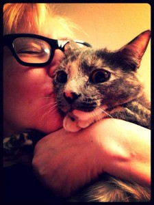 Filmmaker Marina Lutz gives her cat Rosie a big kiss