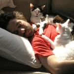 Kent Lambert takes a nap between media remixes with his special kitties Mochi and Asha