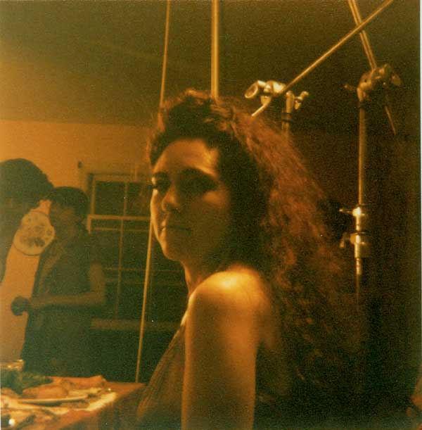 Pretty actress looks at the camera while waiting to film a scene for a movie