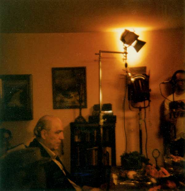 Man sits in chair on film set