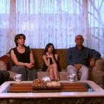 The Jassar Family sit in the living room of their Chicago apartment