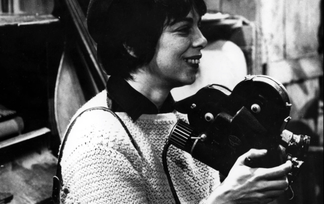Filmmaker Shirley Clarke holding a 16mm camera