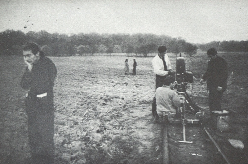 Jonas Mekas directs a scene from his film Guns of the Trees while his crew works a camera dolly