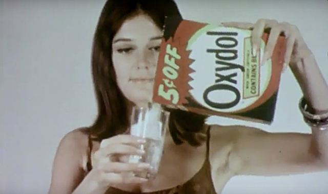 Gloria Steinem pours laundry detergent into a glass in the short film The Pop Show by Fred Mogubgub