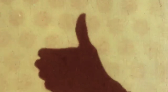 Silhouette of a hand giving the thumbs up from the animated film Swinging the Lambeth Walk by Len Lye