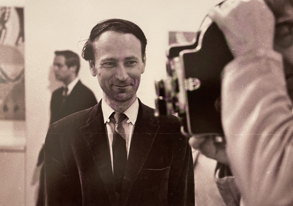 Jonas Mekas watches Marie Menken film in a museum