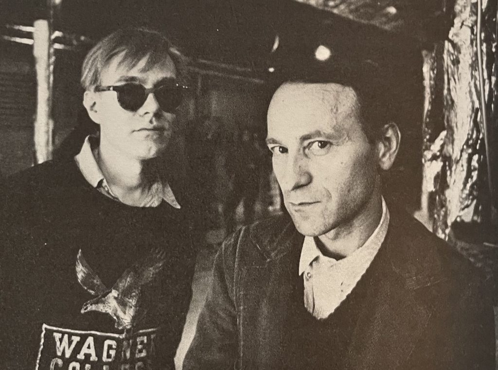 Jonas Mekas standing with artist Andy Warhol