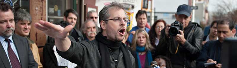 Activist Daniel Goldstein leading a protest
