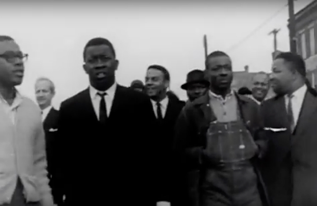 Black men participate in the Selma march organized by Martin Luther King