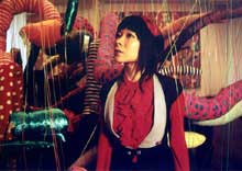 Astria Suparak Colorful portrait of curator Astria Suparak