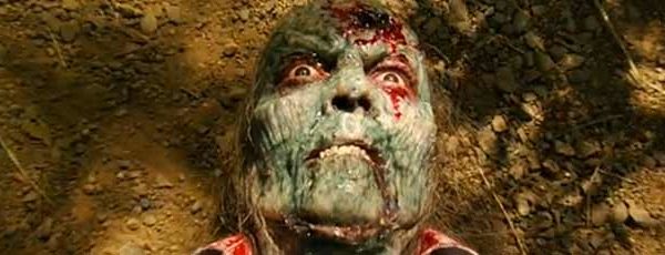 Green zombie with a giant hole in its skull
