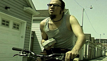 Male hipster riding a bicycle