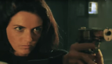 Woman pointing a gun