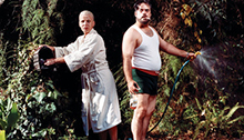Husband and wife working in their garden